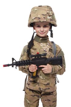 Young boy dressed like a soldier with rifle isolated on white