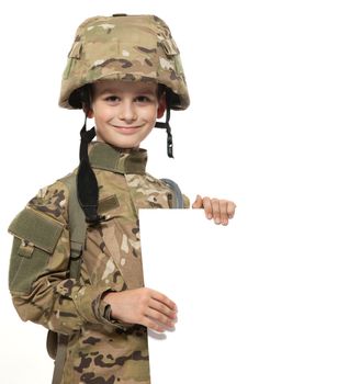 Young Boy Dressed Like a Soldier holding banner isolated on white