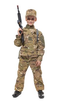 Young boy dressed like a soldier with rifle isolated on white