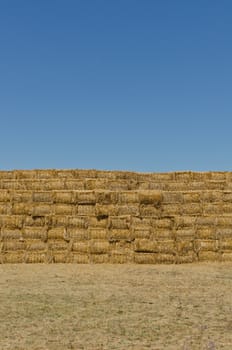 a stack of hay bales, vertical shot