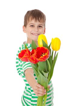 Young boy holding tulips isolated on white