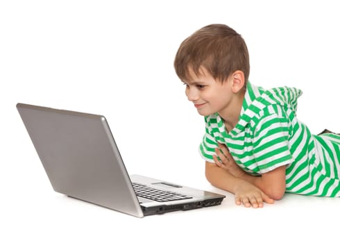 Boy holding a laptop isolated on white background