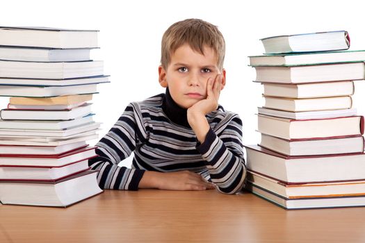 Tired schoolboy isolated on a white background