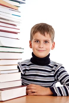 Schoolboy and a heap of books