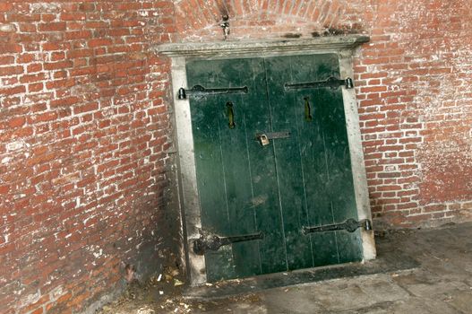 old wooden entrance to a tunnel unther the church of Veere in Holland