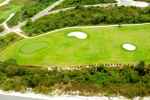 Flying above a golf course at an exotic destination