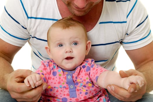 Happy and smiling baby and father. The baby 3 month old. Isolated on a white background.