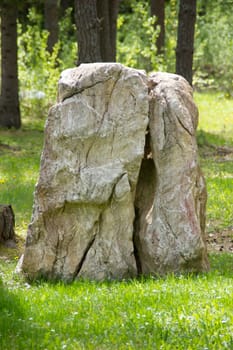 Lonely rock standing in a park