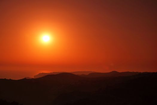 Summer landscape in mountains with the sun