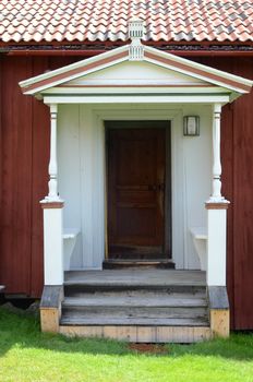 Entrance facade of an old farm in northern Sweden, called "brokvist"