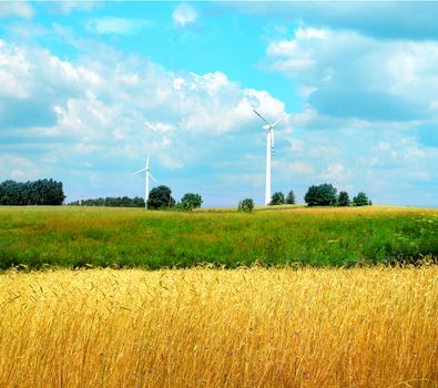 green meadow with Wind turbines generating electricity