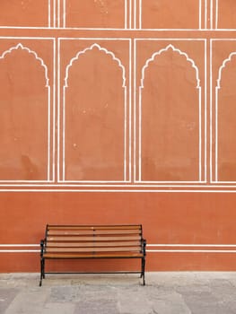 Vintage bench against the india palace wall