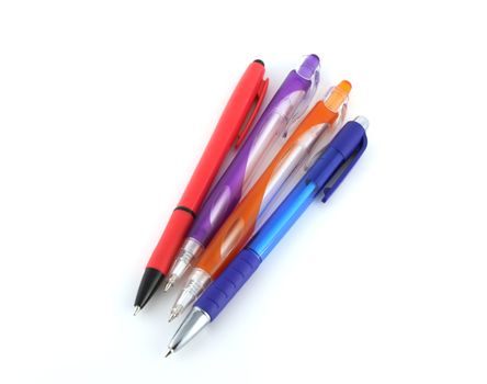 Four color pens over white