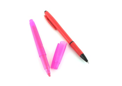 Red pen and pink felt-tip pen over whit