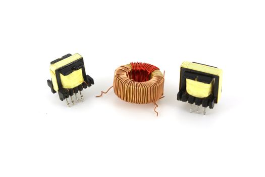 Three electronic transformers over white