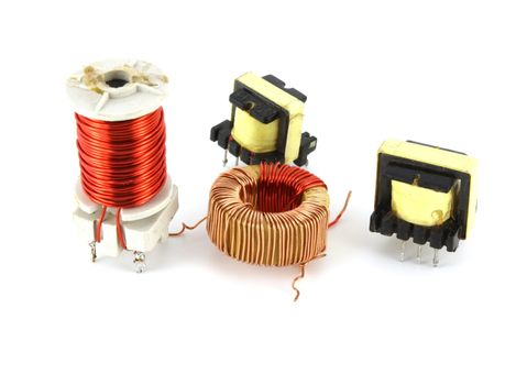 Old electronic transformers over white
