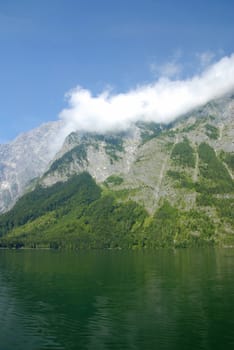 Beautiful Alpine lake with mountains in the back