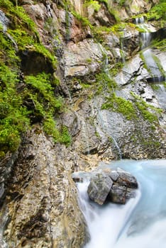 Beautiful alpine brook in the rocky canyon