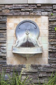 Tuscan Style Wall Water Fountain on Formal Courtyard Garden