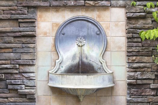 Tuscan Style Wall Water Fountain on Formal Courtyard Garden Horizontal
