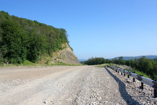 Summer landscape. Track on the mountains.