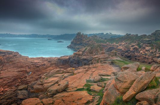 Heavy sky over the rocks from The Pink Granite Coast in Brittany in northwestern part of France.