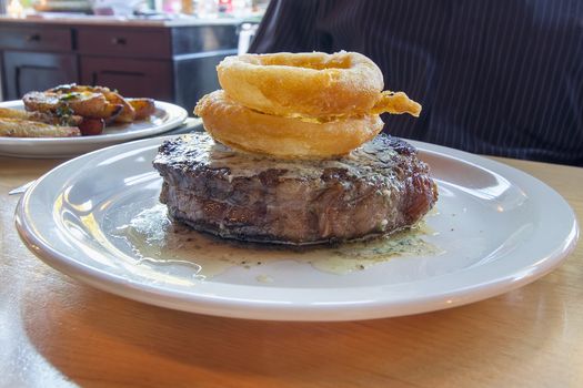 Ribeye Steak with Fried Sweet Onion Rings and Blue Cheese Butter Sauce