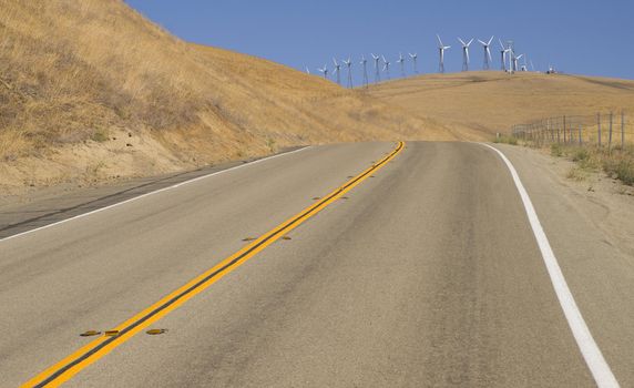 A California side road leads to a sizable wind farm