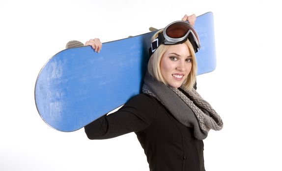 A Beautiful Blonde Woman poses with her Snowboard
