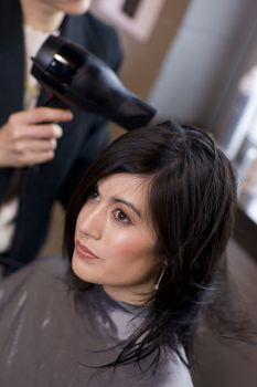 A haircut and blow dry at the salon
