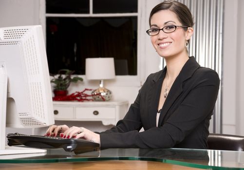A pretty receptionist smiles at the viewer