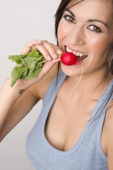 Beautiful Brunette Eats Radish