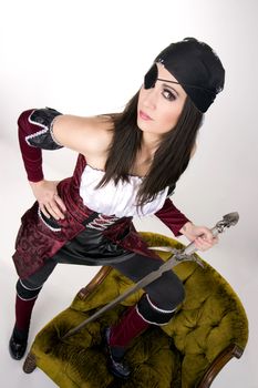 A pirate woman with an eye patch shows her sword
