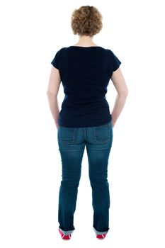 Rear view of woman posing in style, full length shot