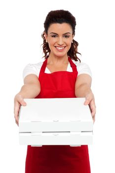 Here is your order sir. Hot pizza at your doorstep. Enjoy your meal. Woman delivering pizza
