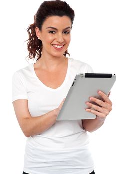 Pretty woman using tablet device isolated against white background
