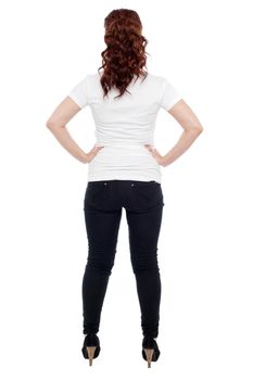 Rear view of a young woman over white background