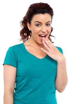 An amazed pretty brunette isolated on white background.