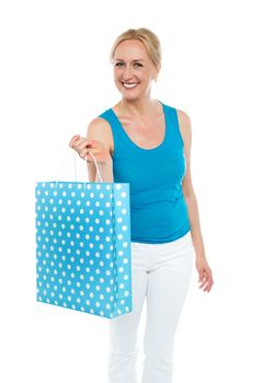 Shopping woman carrying bag, enjoying sale. All on white background