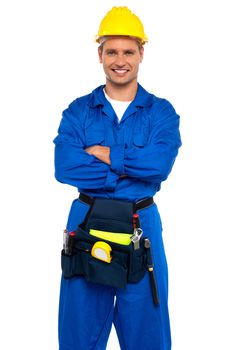 Young industrial contractor posing with crossed arms isolated over white background