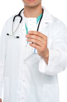 Cropped image of physician displaying medicine pack in front of camera
