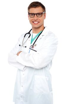 Confident smiling physician posing with arms crossed against white background