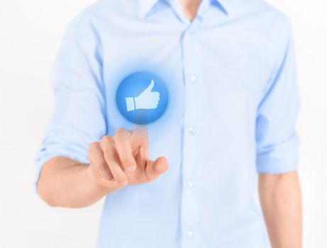 Man touching social media button with thumb up symbol on a virtual screen. Isolated on white.