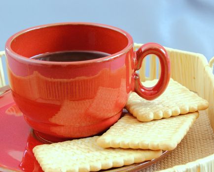 detail of a filled red coffee cup