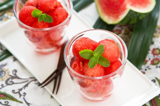 Watermelon scoop in glasses with mint