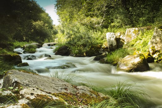 Fast river forming rapids in Caldas de Reis, Galicia
