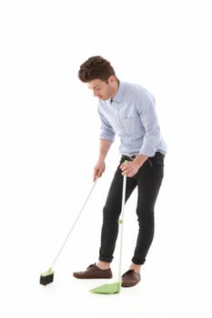 Adult young man singing while cleaning the floor