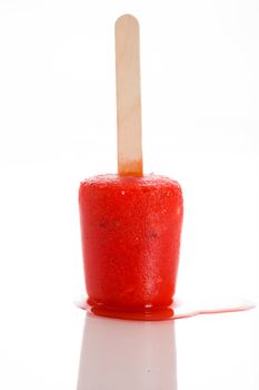 watermelon popsicle that begin to melt on white background