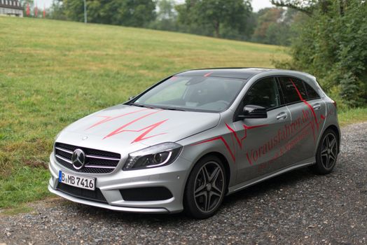 STUTTGART – SEPTEMBER 1: A Mercedes Benz A-Class car during a test drive in front of Solitude Castle on September 1, 2012 in Stuttgart, Germany. A few weeks before the official availability of the new A-Class Mercedes is touring through various European Cities where the public can test drive the car already.