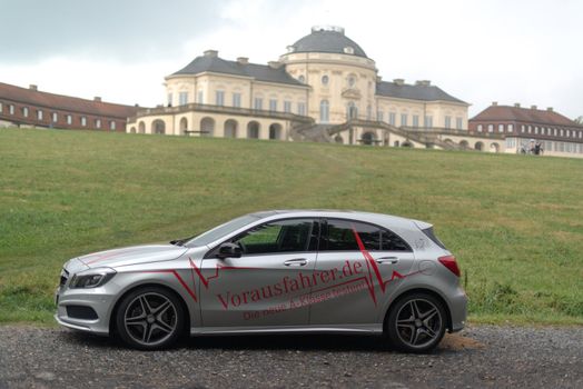 STUTTGART – SEPTEMBER 1: A Mercedes Benz A-Class car during a test drive in front of Solitude Castle on September 1, 2012 in Stuttgart, Germany. A few weeks before the official availability of the new A-Class Mercedes is touring through various European Cities where the public can test drive the car already.